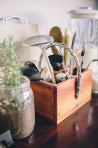Collection of cooking utensils on a wooden kitchen counter